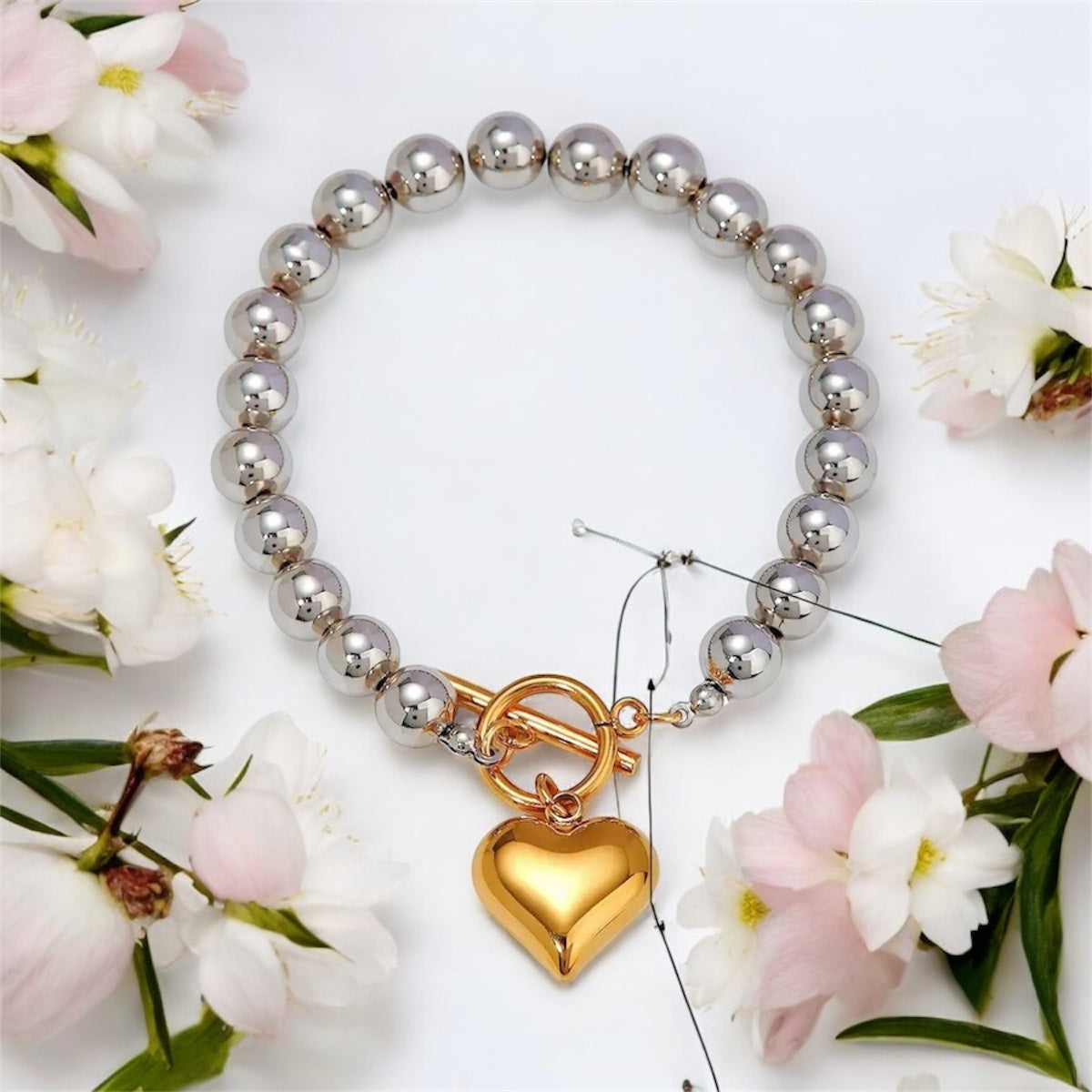 Bracciale Sfera cuore d’oro.